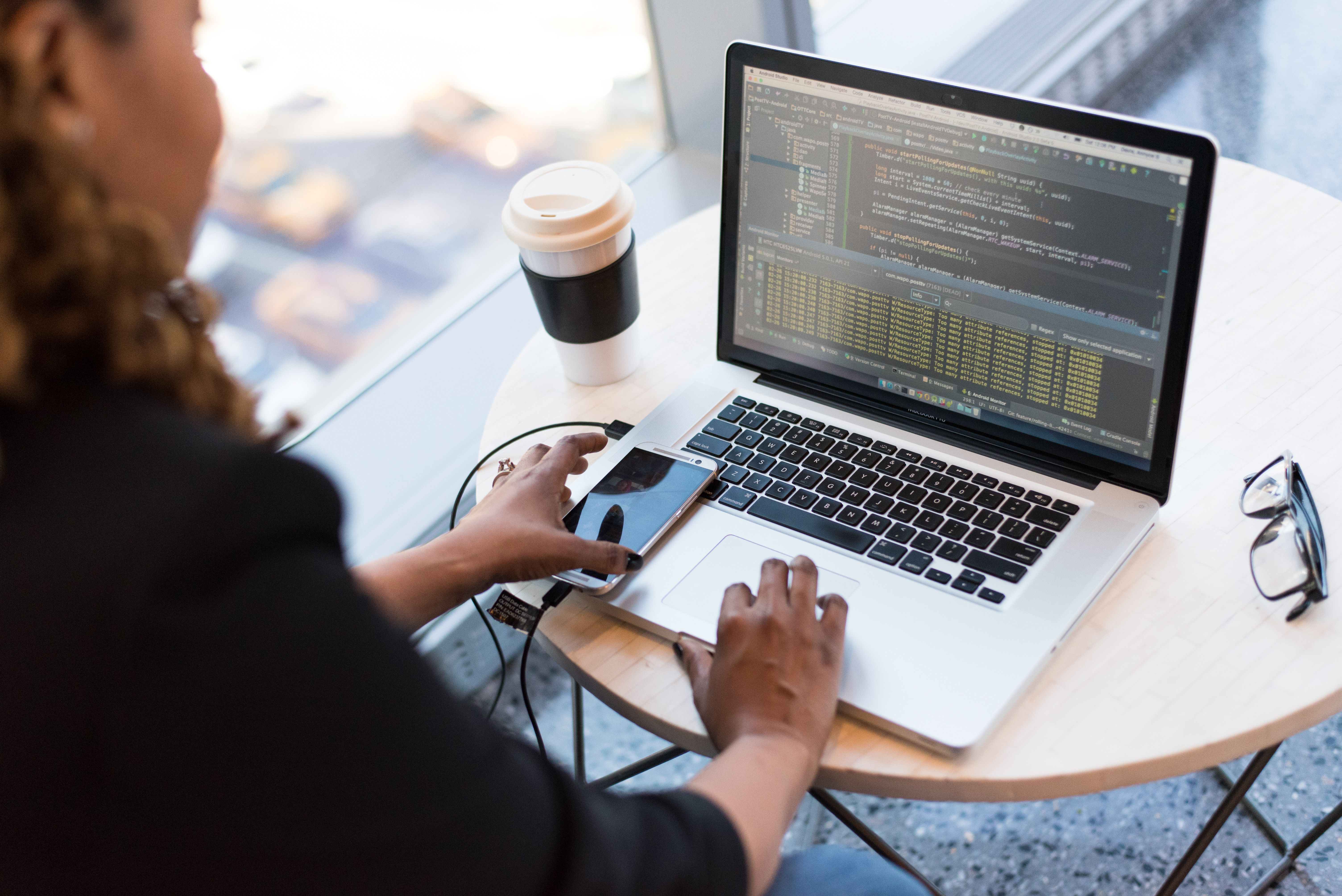 Female technician at work on a laptop computer