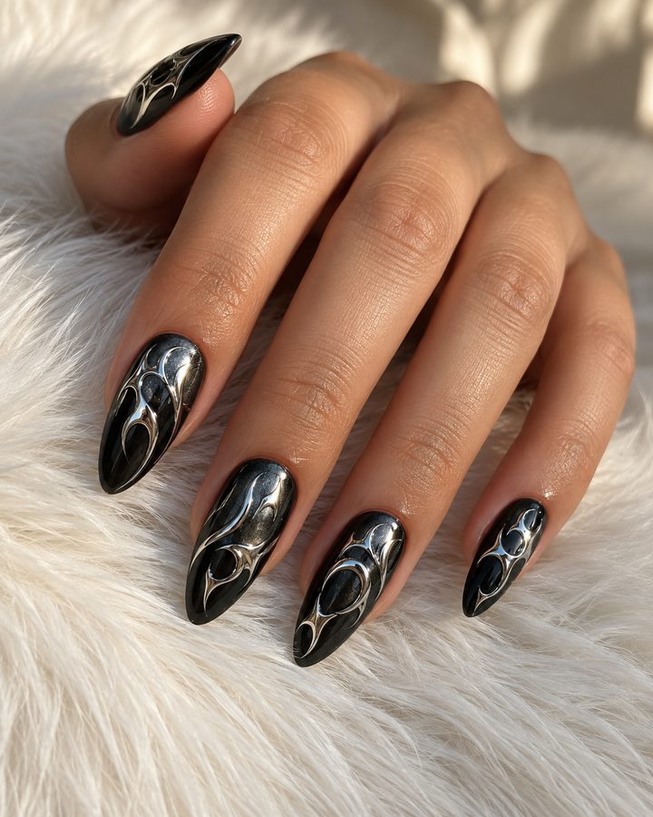 Black chrome almond nails with silver swirl art
