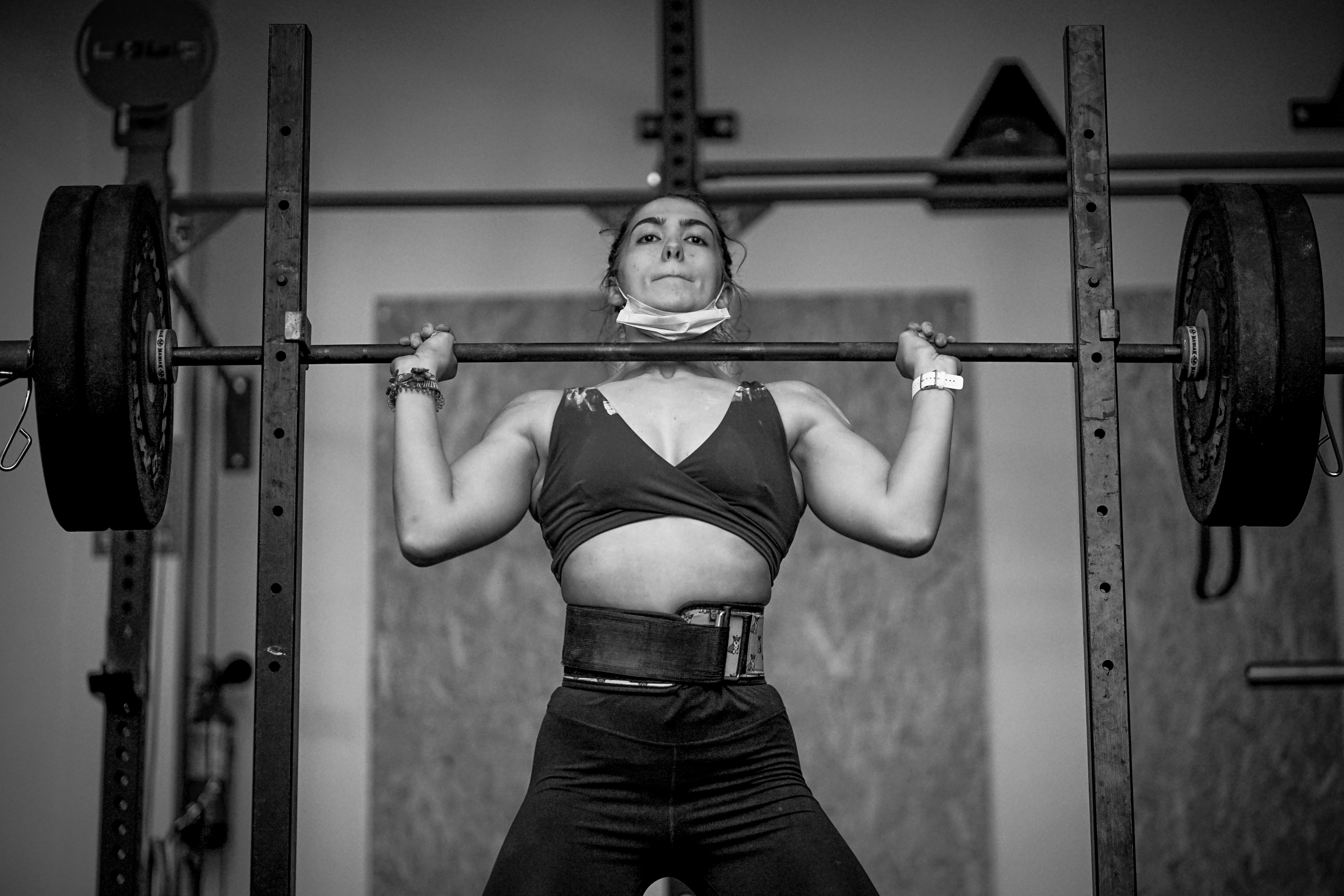 woman lifting with a belt woman lifting with a belt