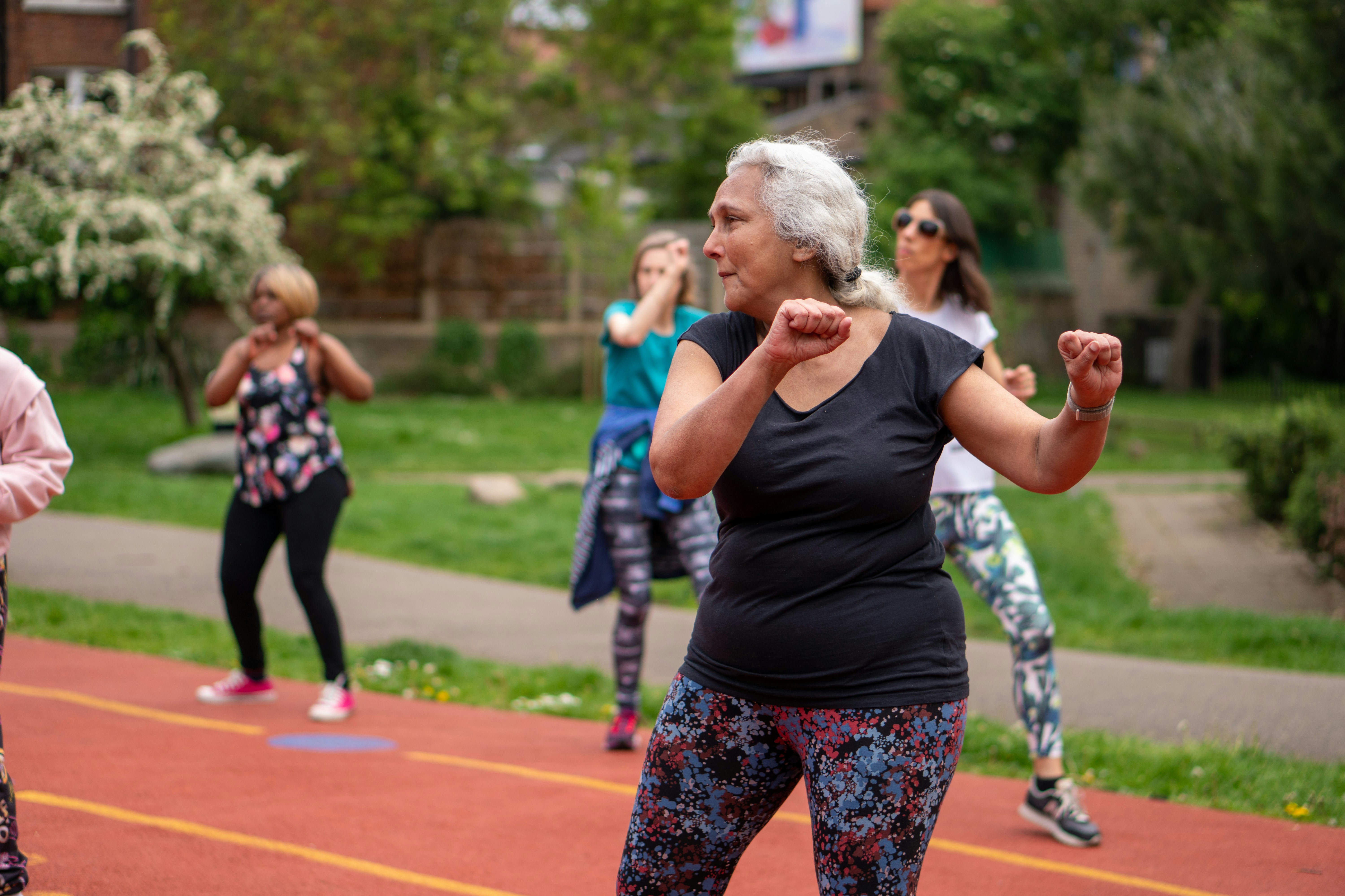 woman swinging her arms while exercising 
