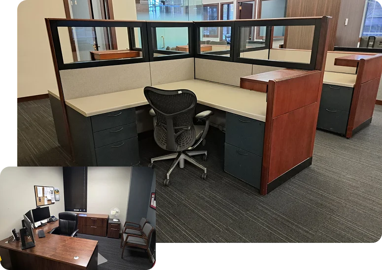 An empty L-shaped office cubicle with a black chair, desk, and dividers, featuring wood and glass accents.