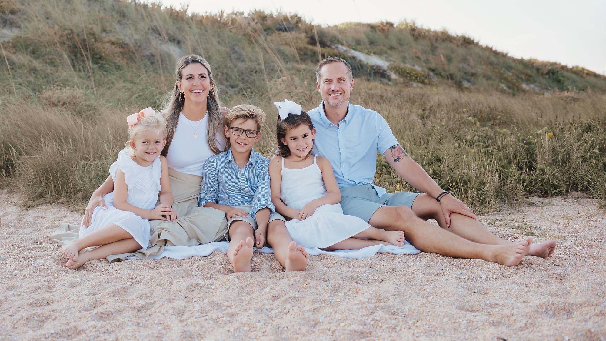 Carissa Hetrick with her husband and three kids on the beach