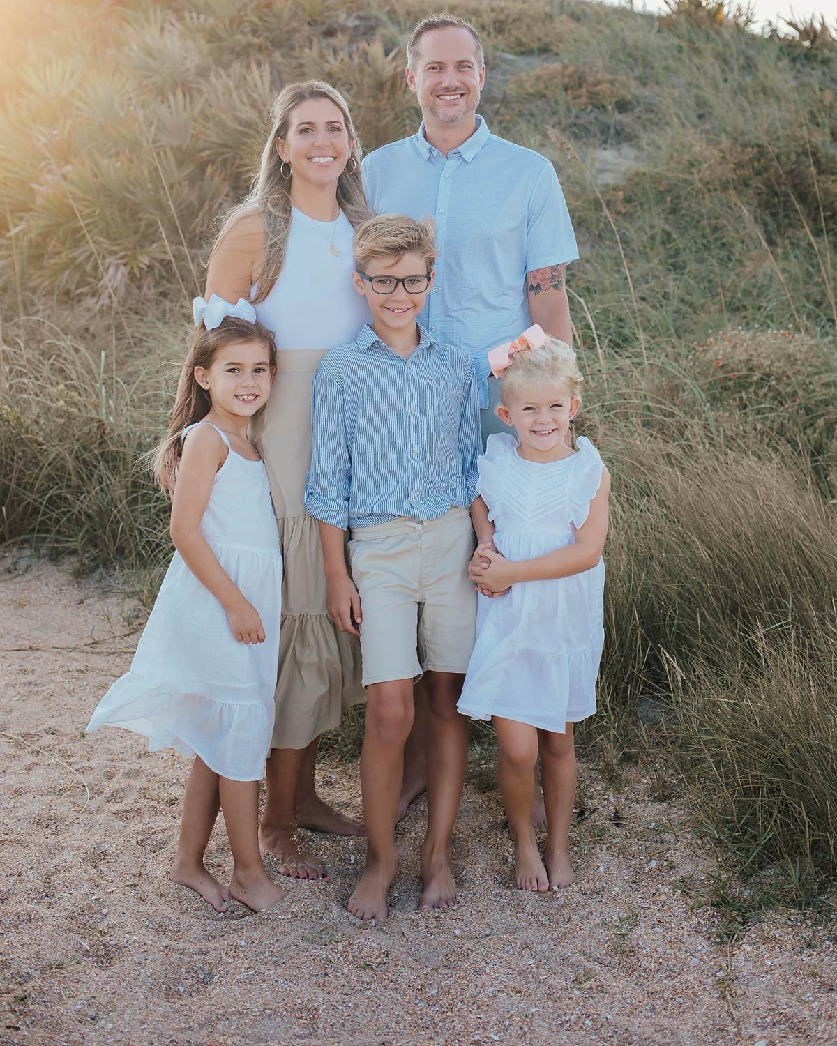Carissa Hetrick with her family at sunset on the beach
