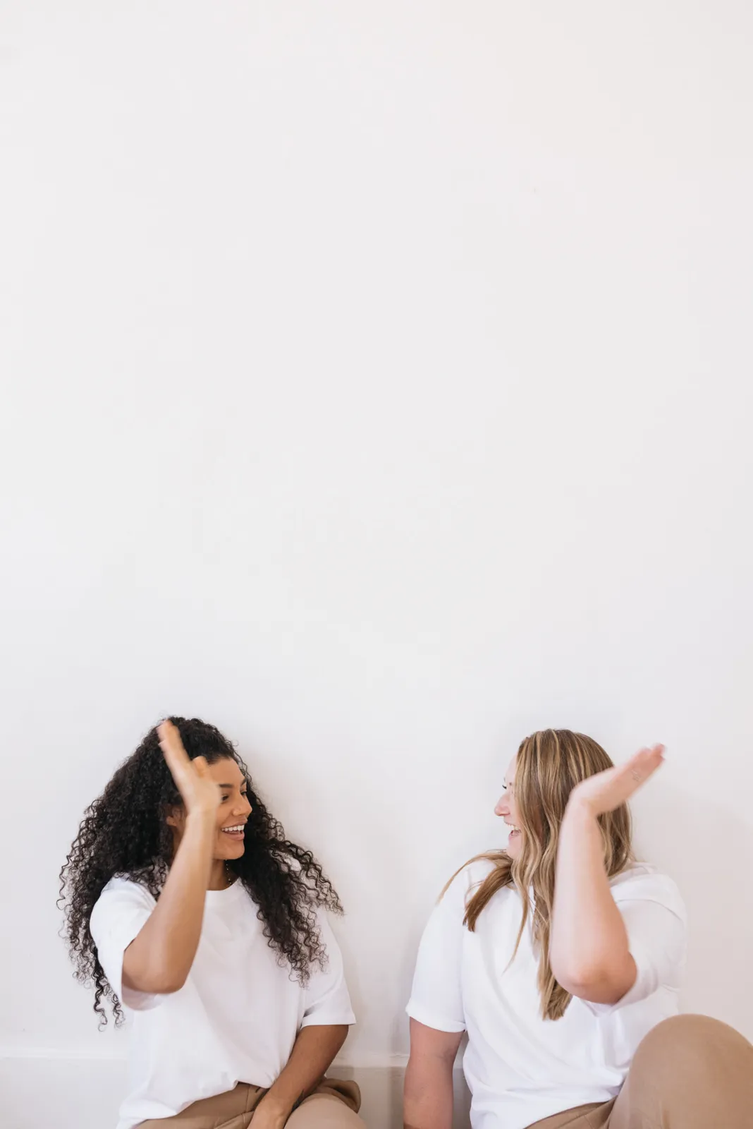Two women high-fiving