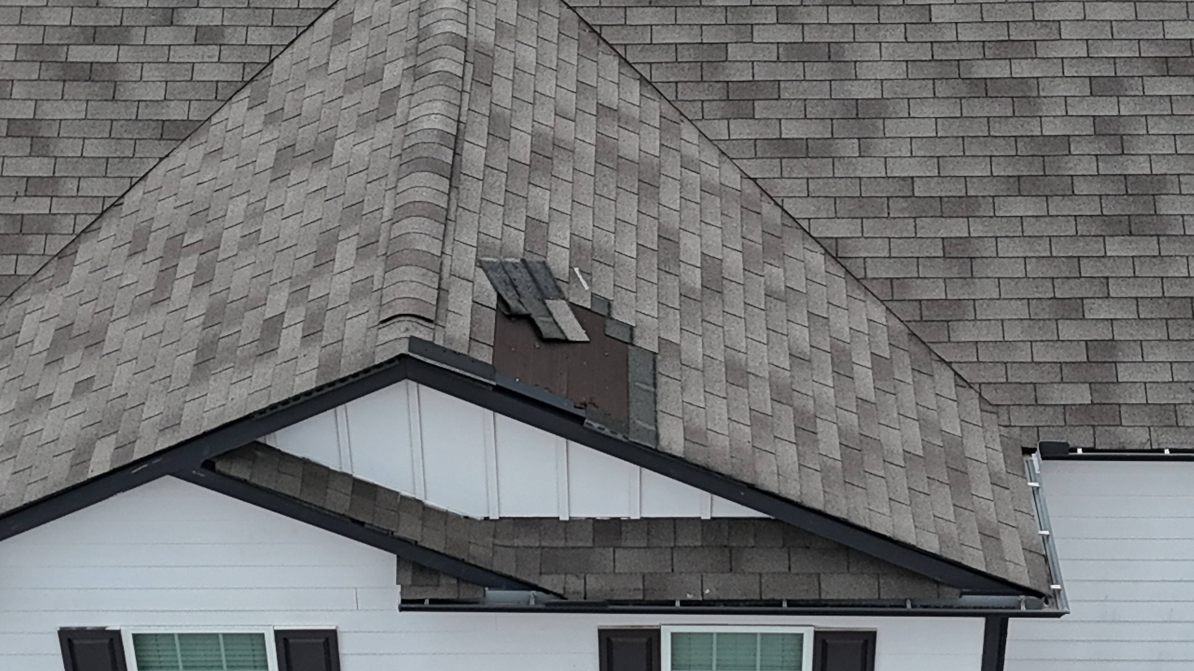 Storm damage repair in Douglasville, GA Wind damaged shingles Douglasville GA - Rooftops Unlimited