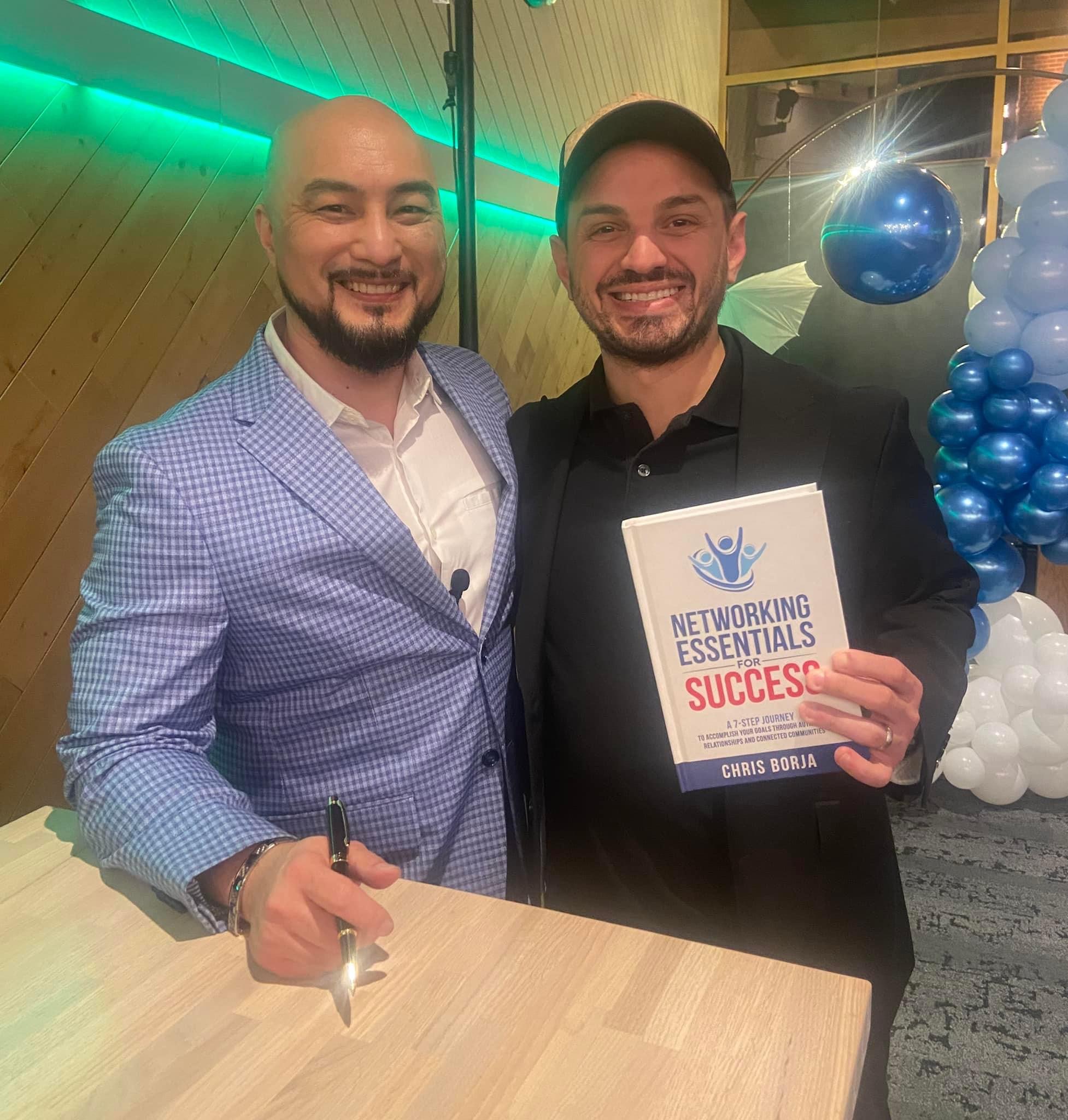 Chris Borja with a reader of Networking Essentials for Success