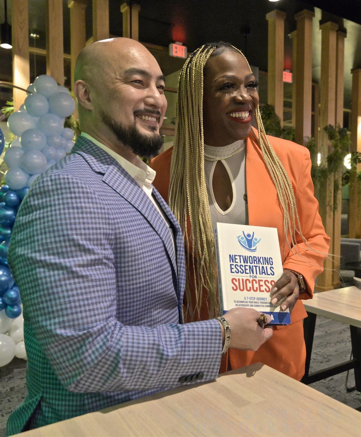 Chris Borja with a reader of Networking Essentials for Success