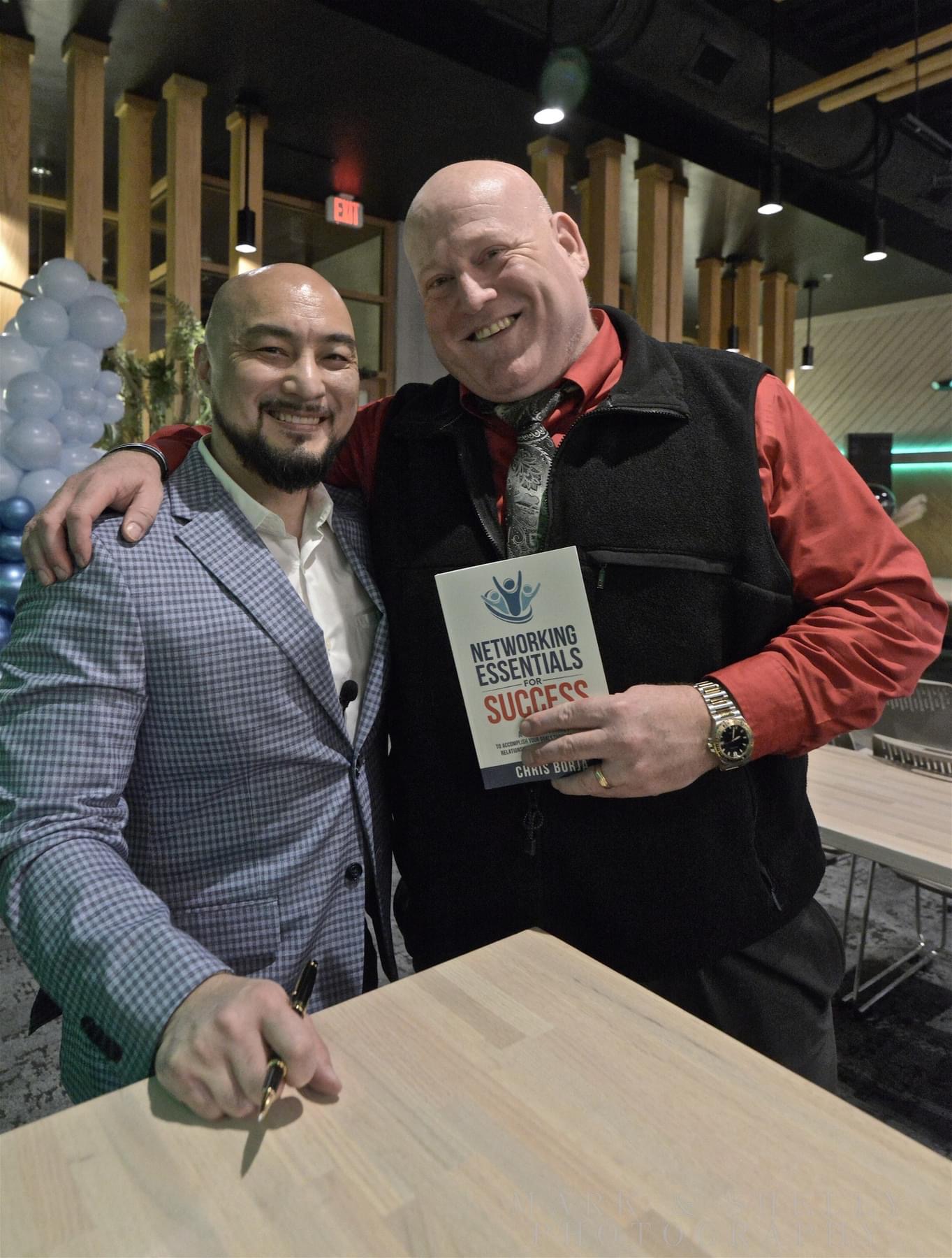 Chris Borja with a reader of Networking Essentials for Success