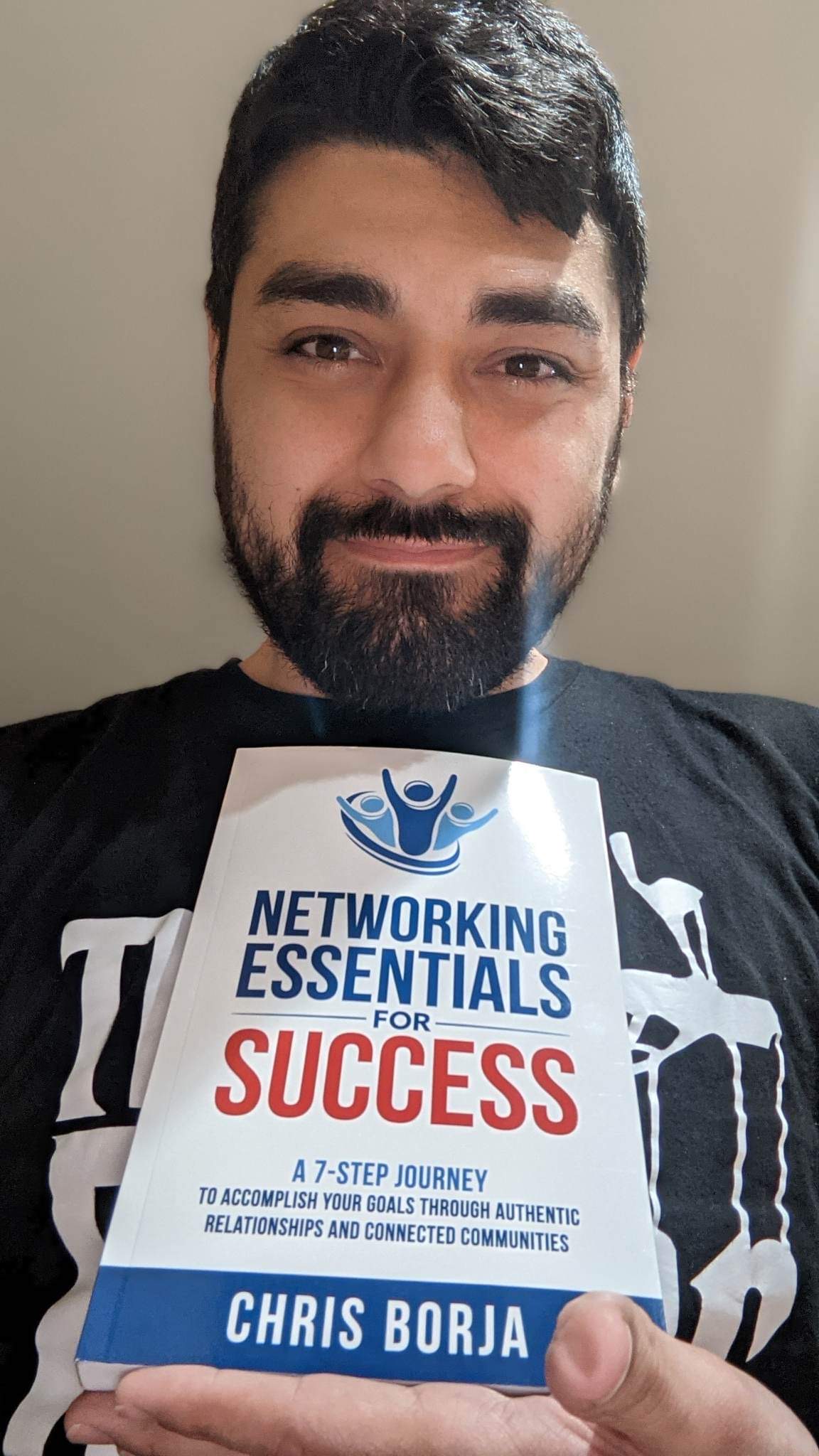 Chris Borja with a reader of Networking Essentials for Success