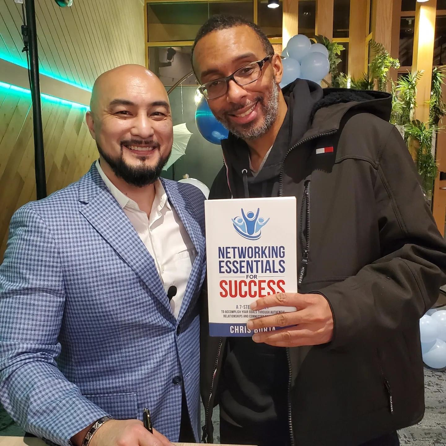 Chris Borja with a reader of Networking Essentials for Success