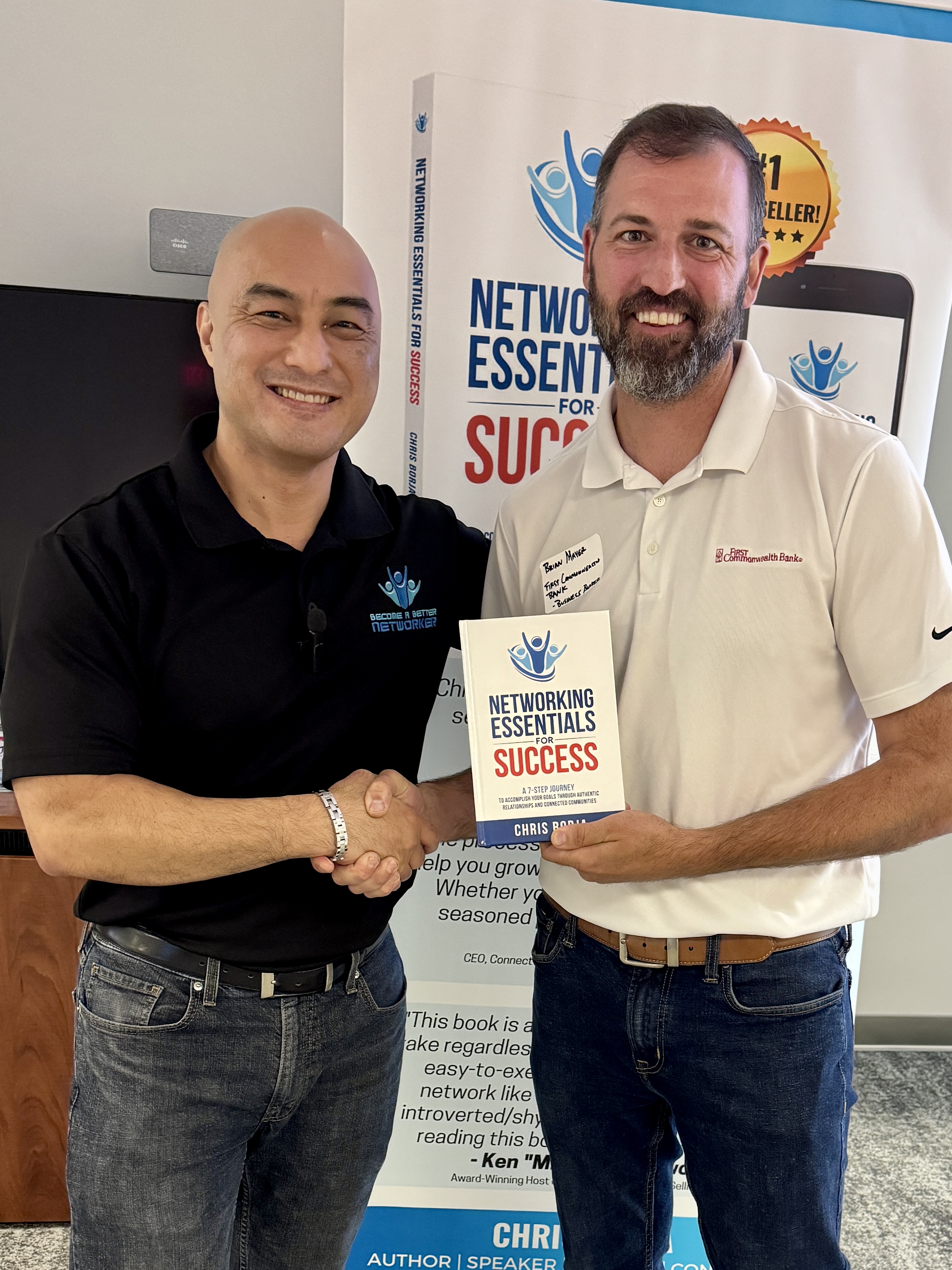 Chris Borja with a reader of Networking Essentials for Success