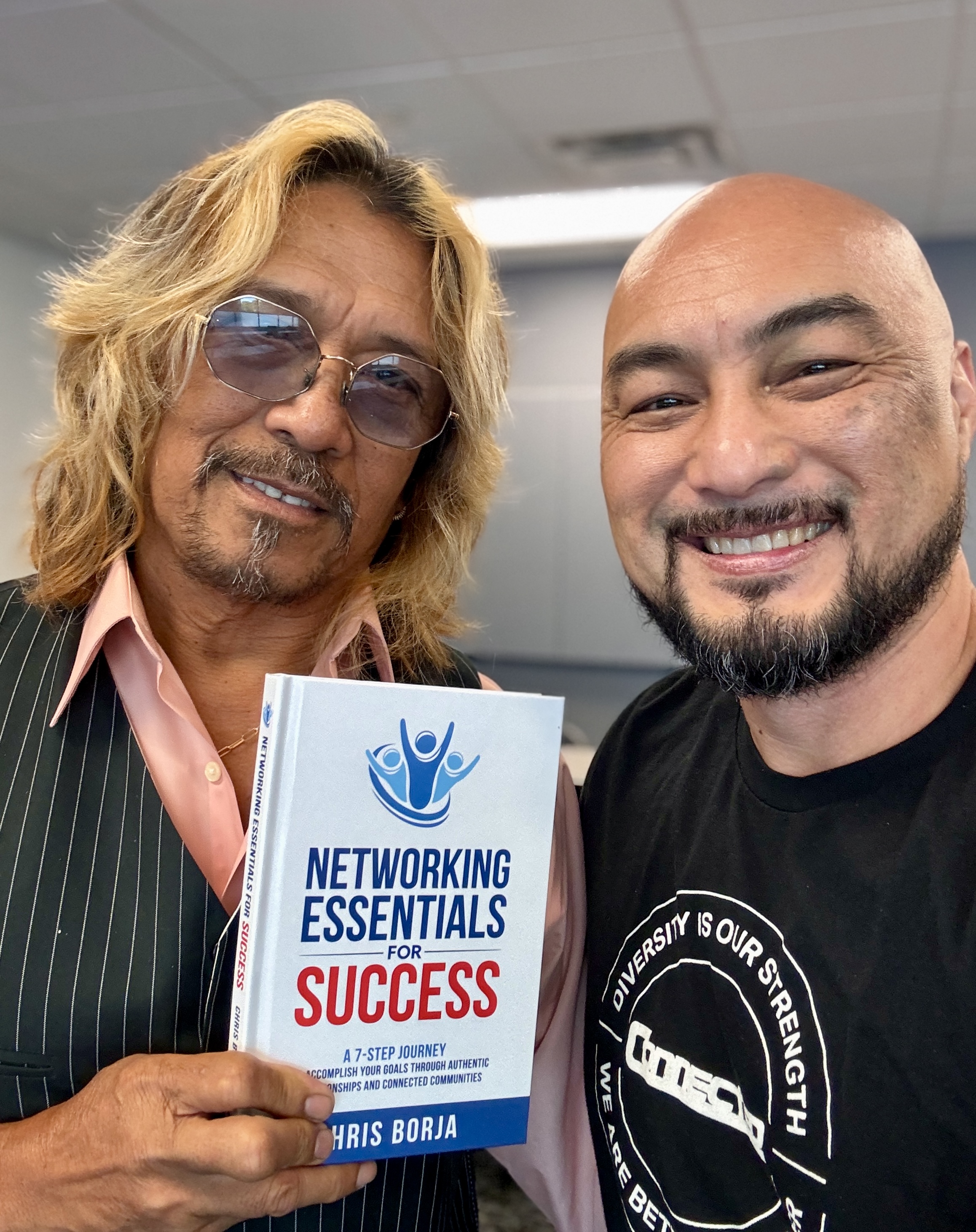 Chris Borja with a reader of Networking Essentials for Success
