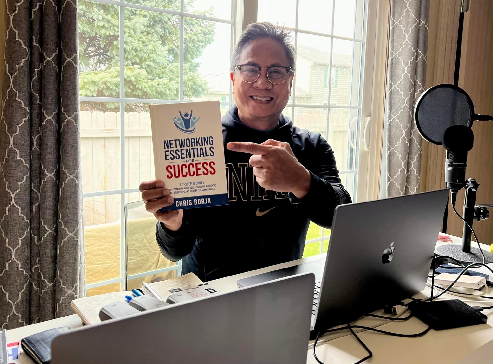 Chris Borja with a reader of Networking Essentials for Success