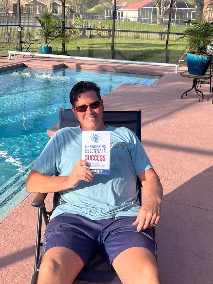 Chris Borja with a reader of Networking Essentials for Success
