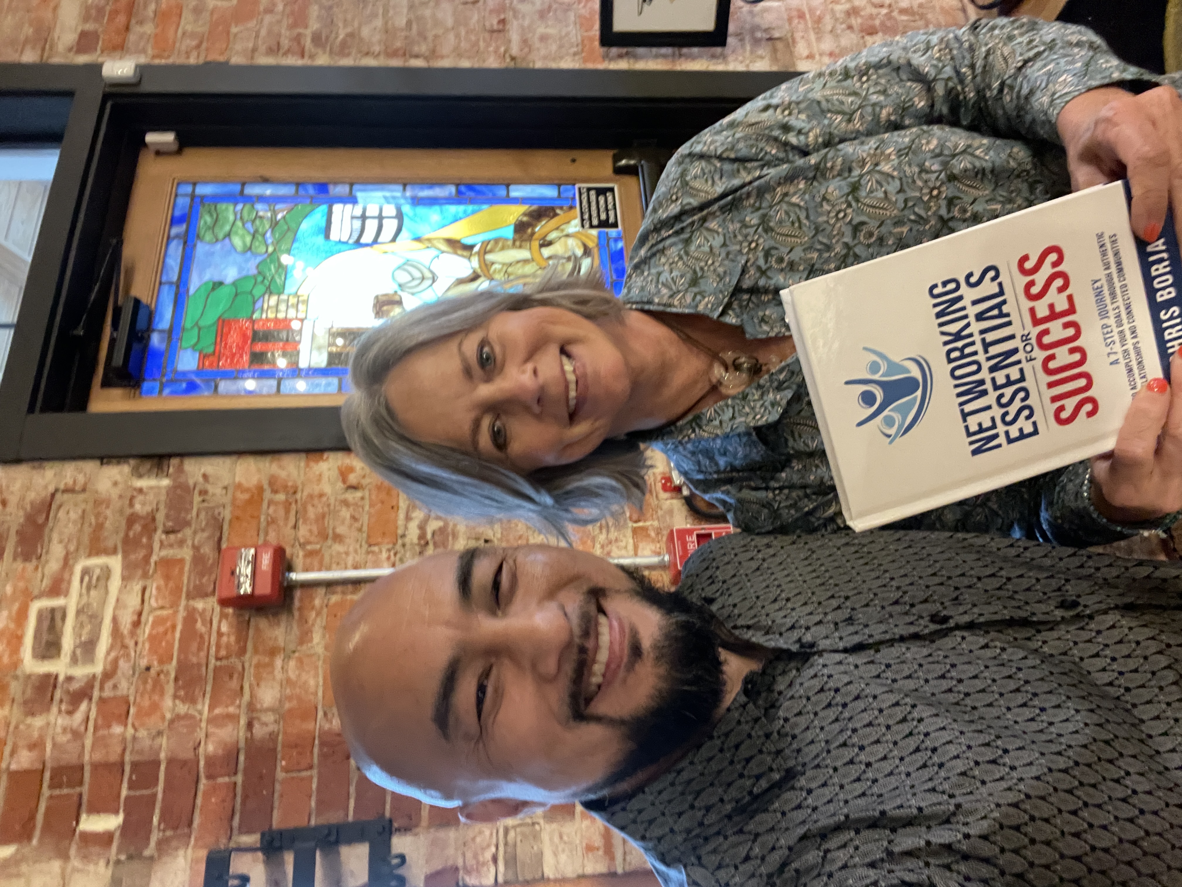 Chris Borja with a reader of Networking Essentials for Success