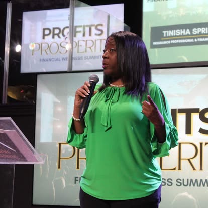 Tinisha speaking onstage at Profits and Prosperity