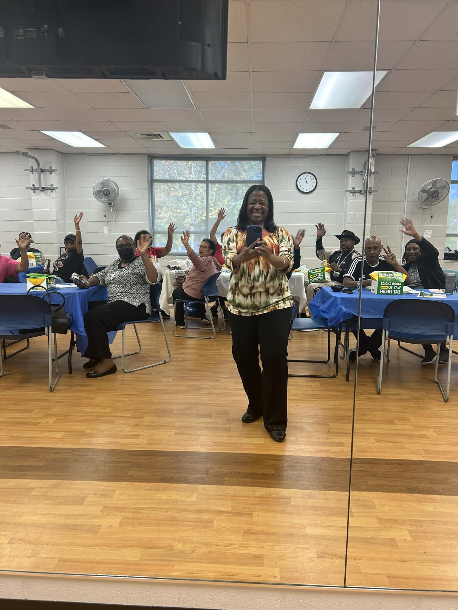 Tinisha with an engaged community group