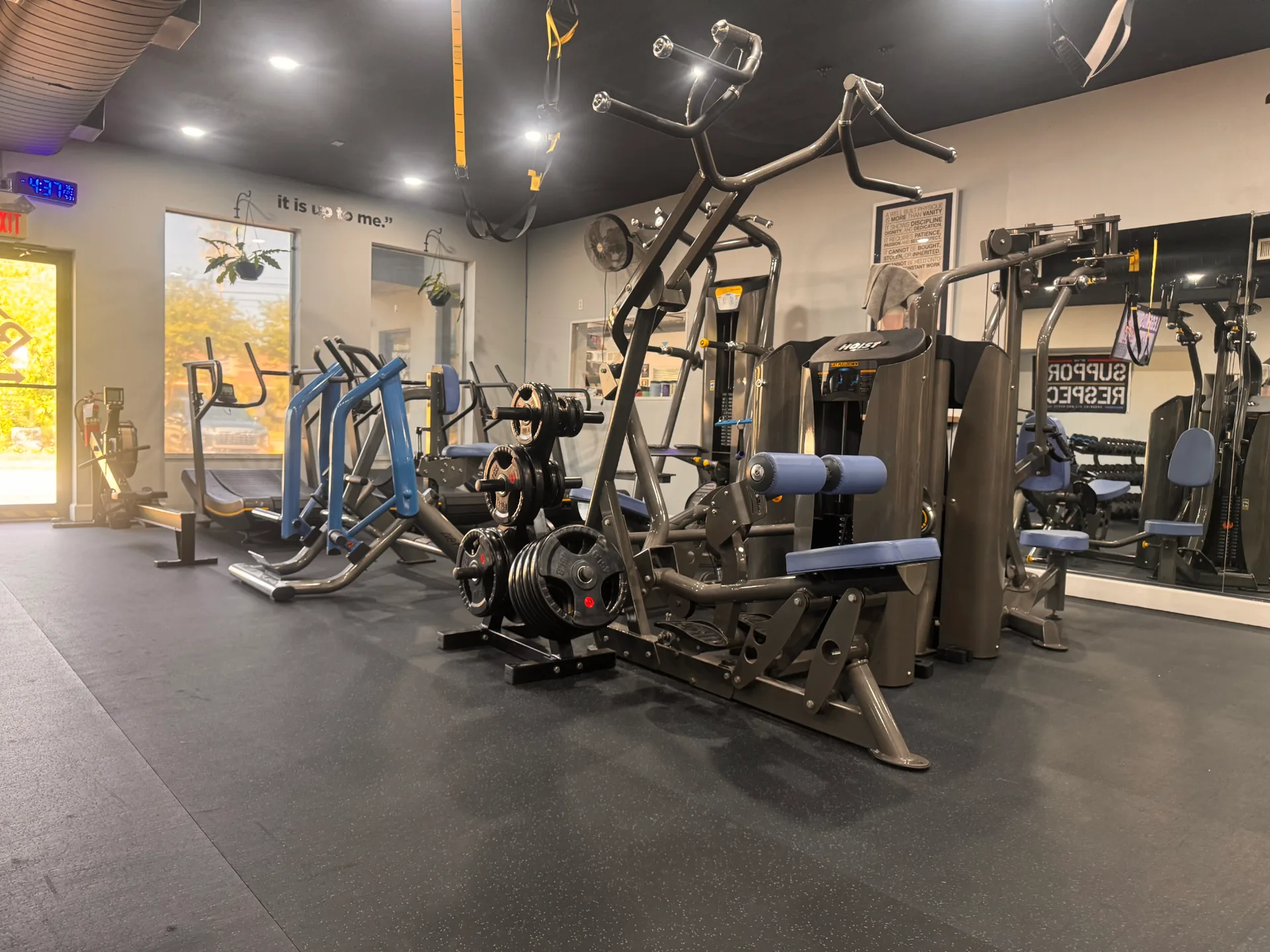 Empty strength training area with machines and weights