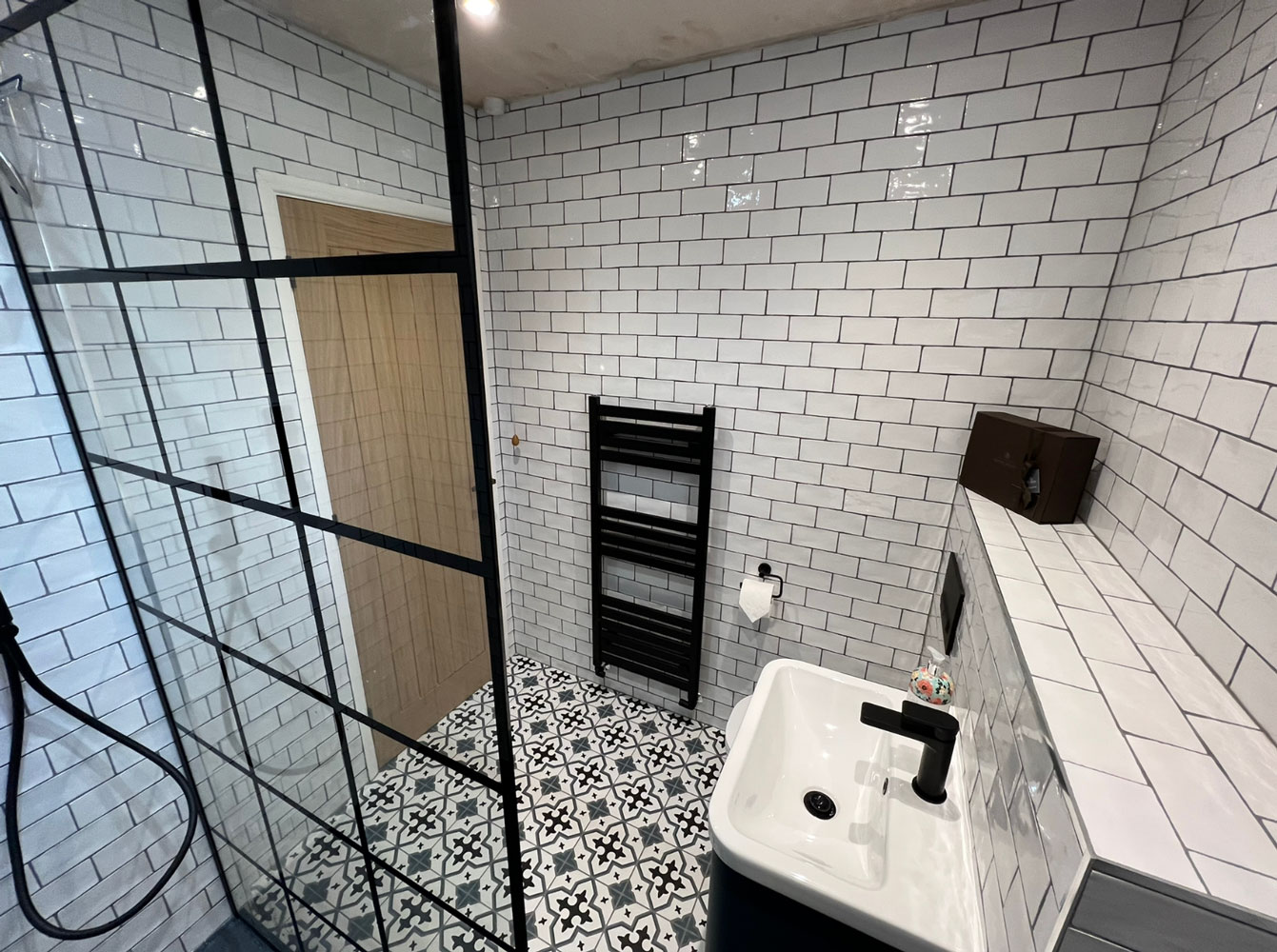 Contemporary bathroom with black framed shower screen