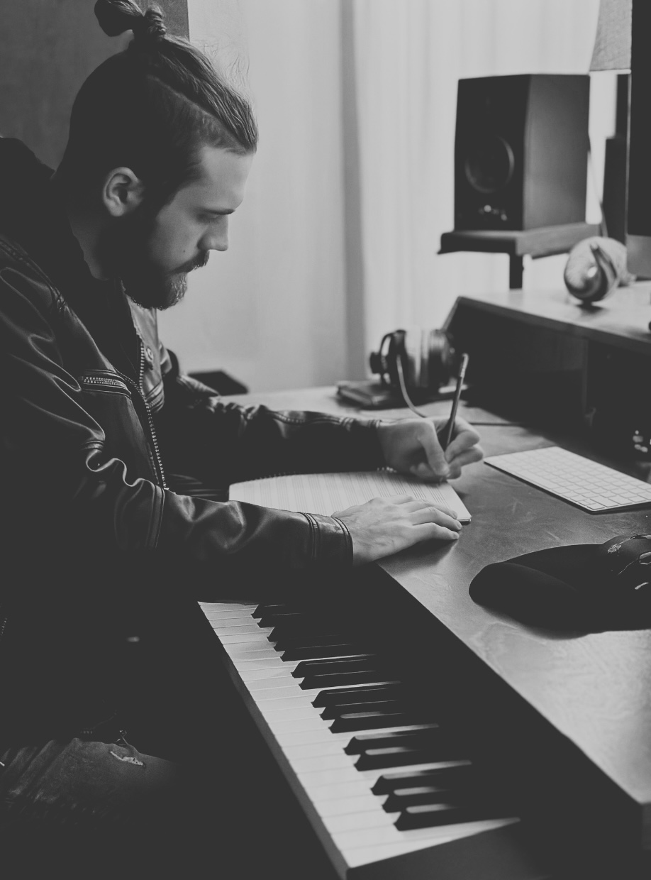 Jordan Green writing music at a desk