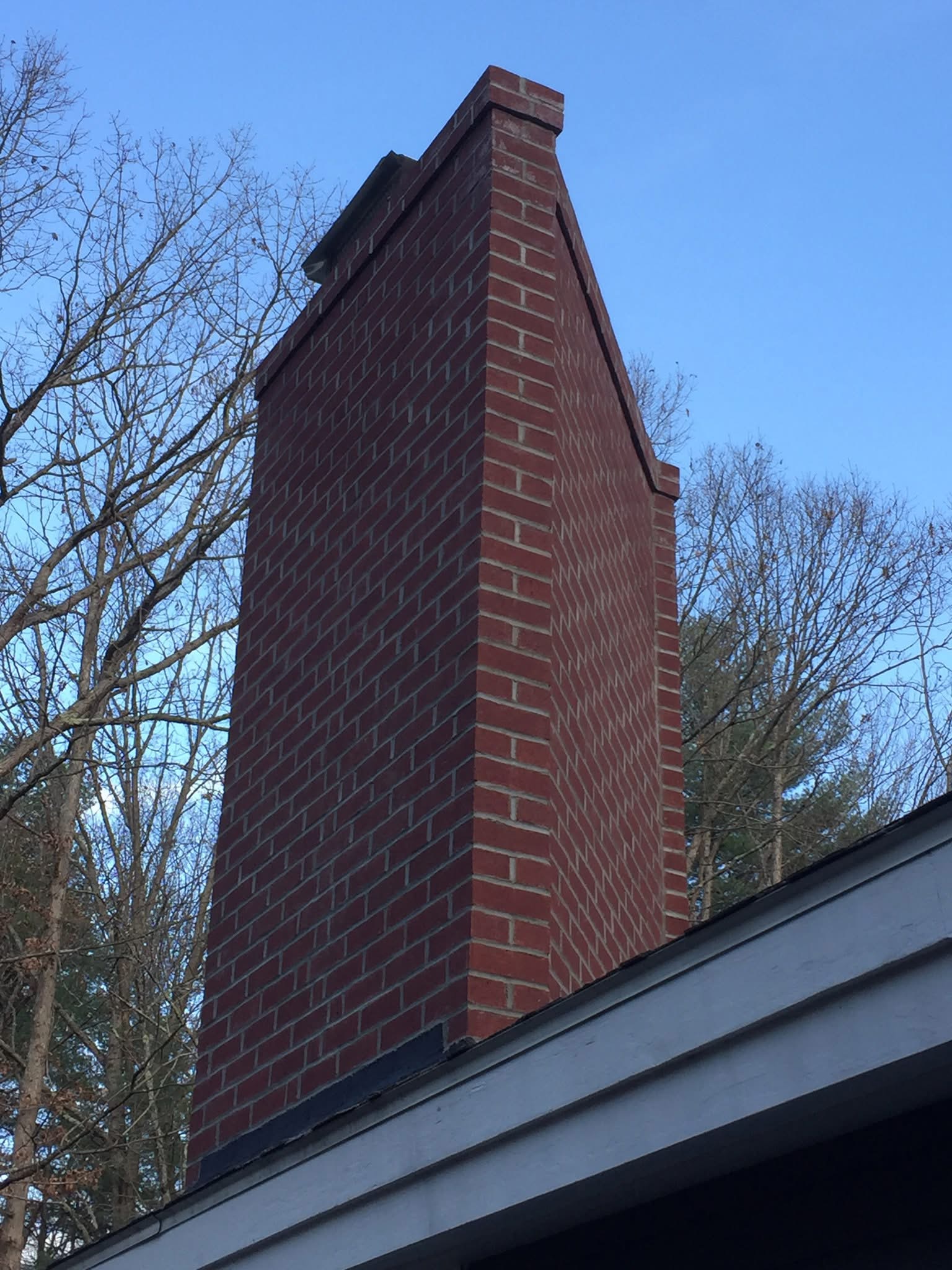 Chimney rebuild and custom brick masonry by Integrity Exterior Solutions