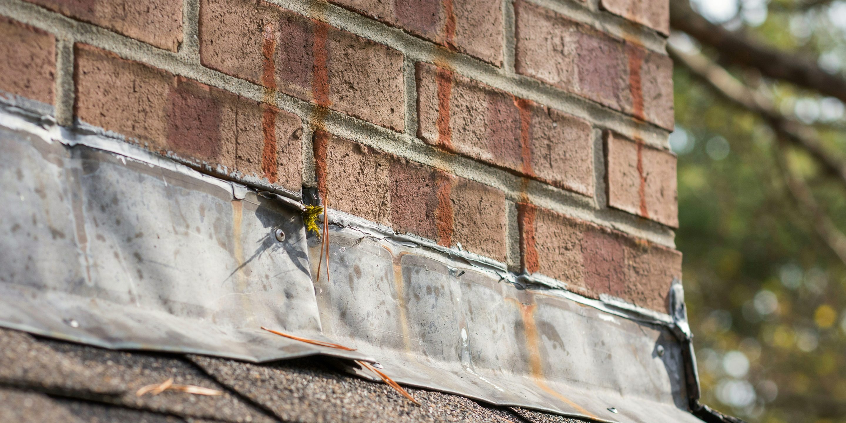Flashing where roof meets brick chimney