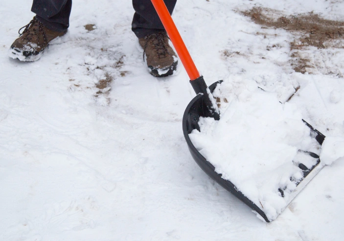 Snow removal from sidewalks and pathways to reduce slip hazards in Wright County