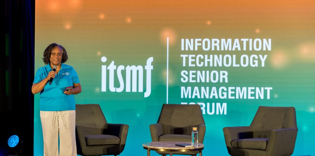 Dawn speaking on stage at an ITSMF event
