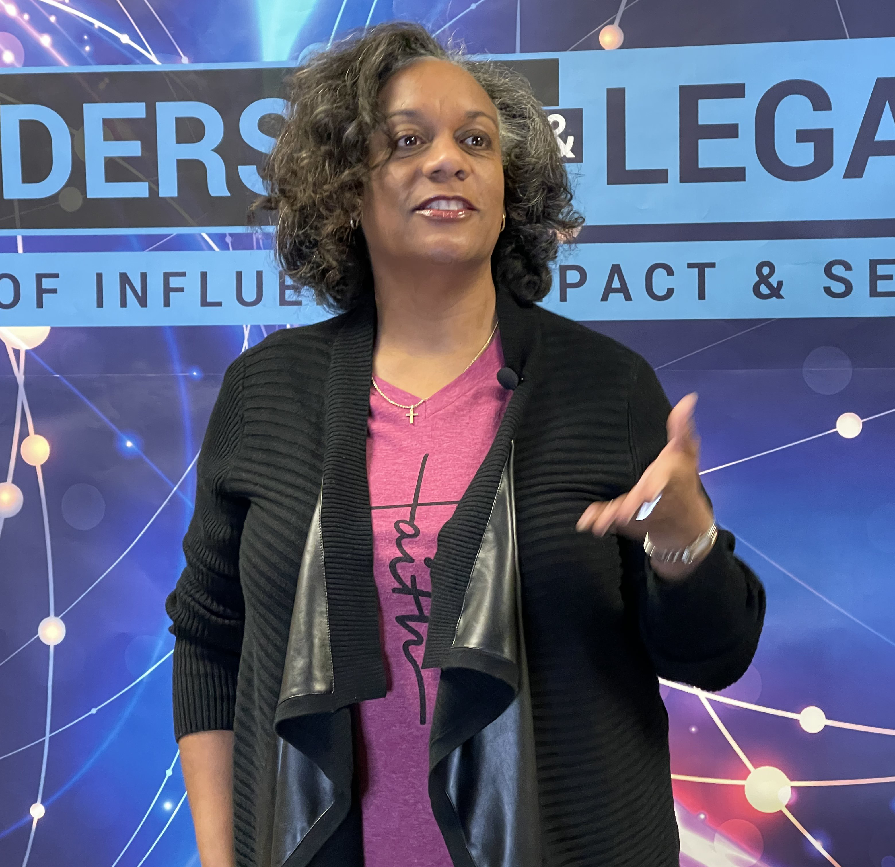 Dawn speaking at an ITSMF event, mid-gesture