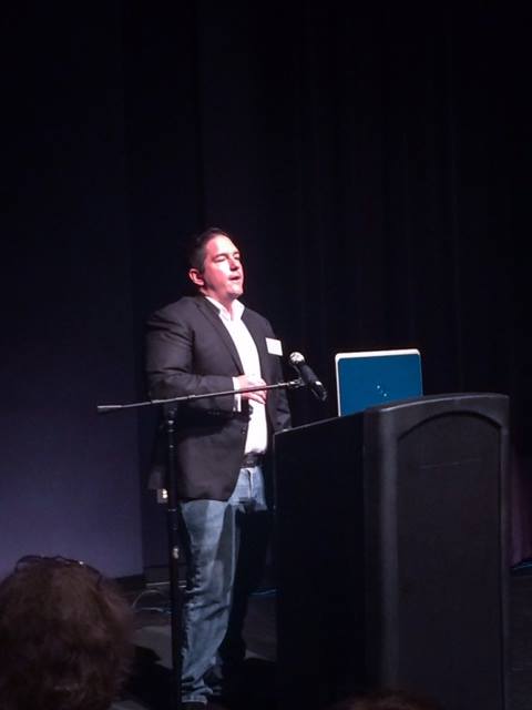 Sean Hyde speaking on stage