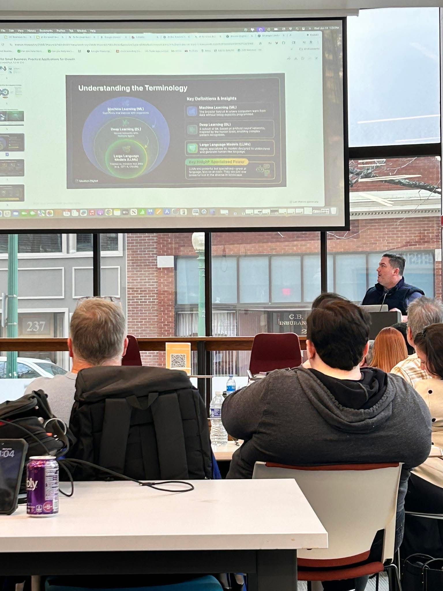 Business owners following along with a Sean Hyde workshop in a University of Charleston classroom