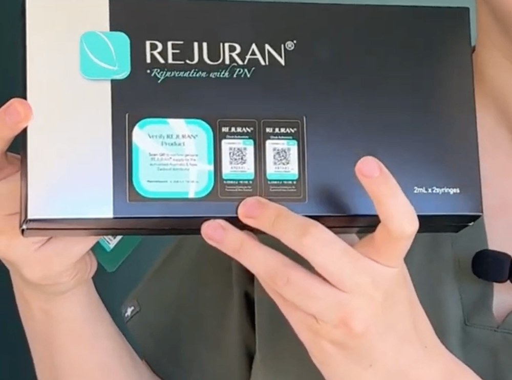 Rejuran product box held by a Kozie Skin Clinic nurse