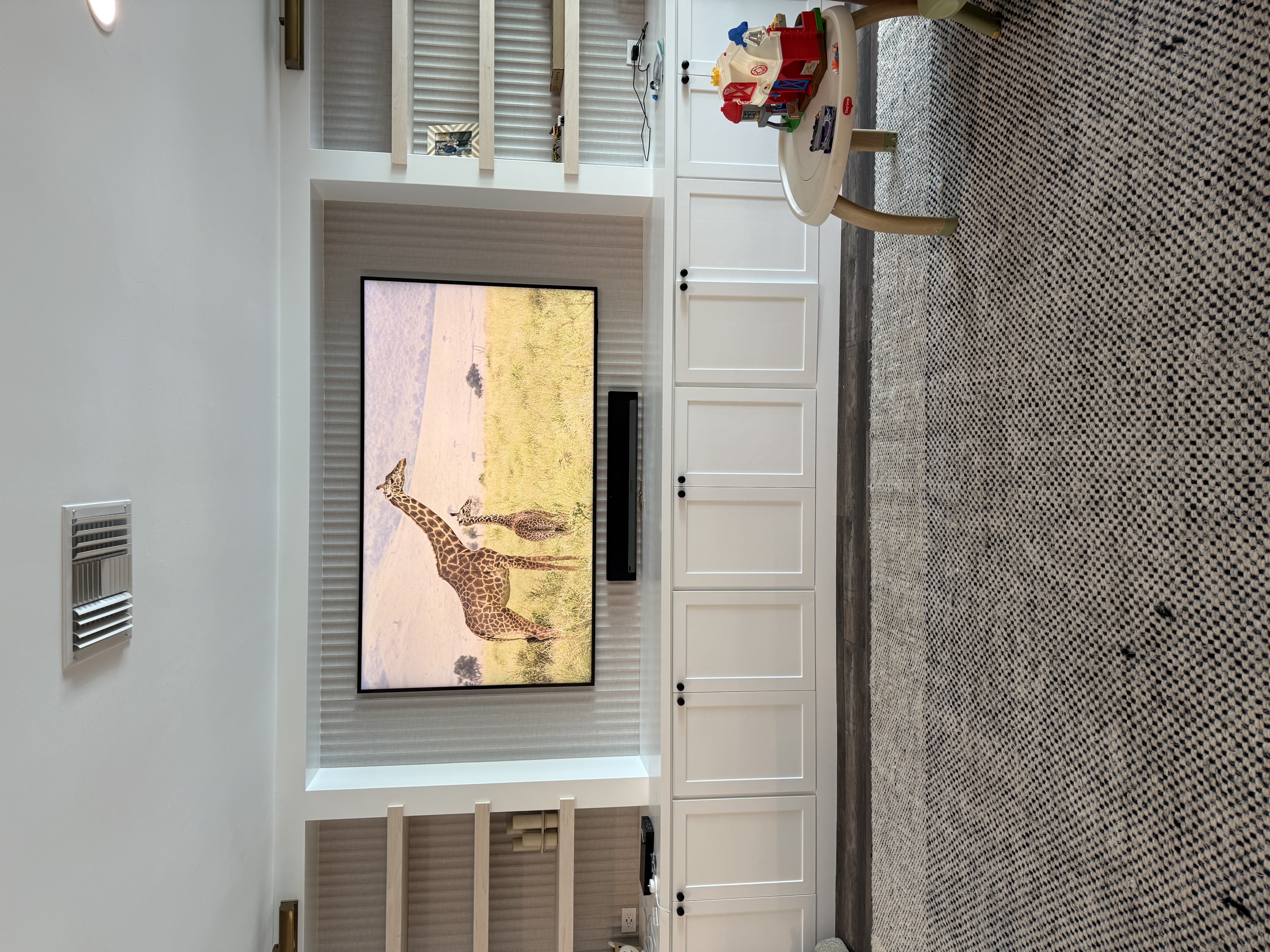 TV mounting service in Bradenton, Florida featuring a large-screen TV mounted on a living room wall