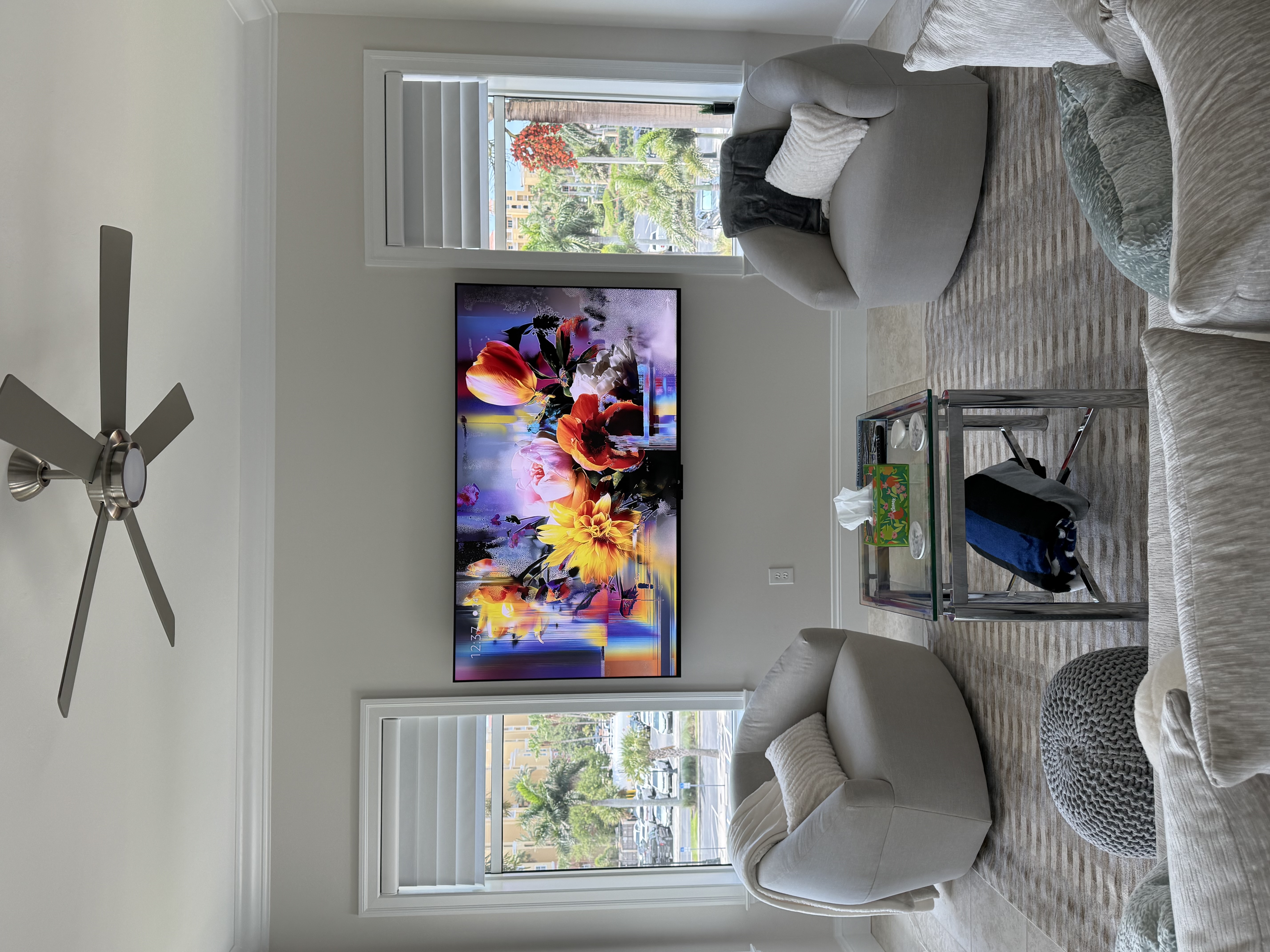 Wall-mounted TV with a power connection installed behind the TV for a clean cord-free appearance