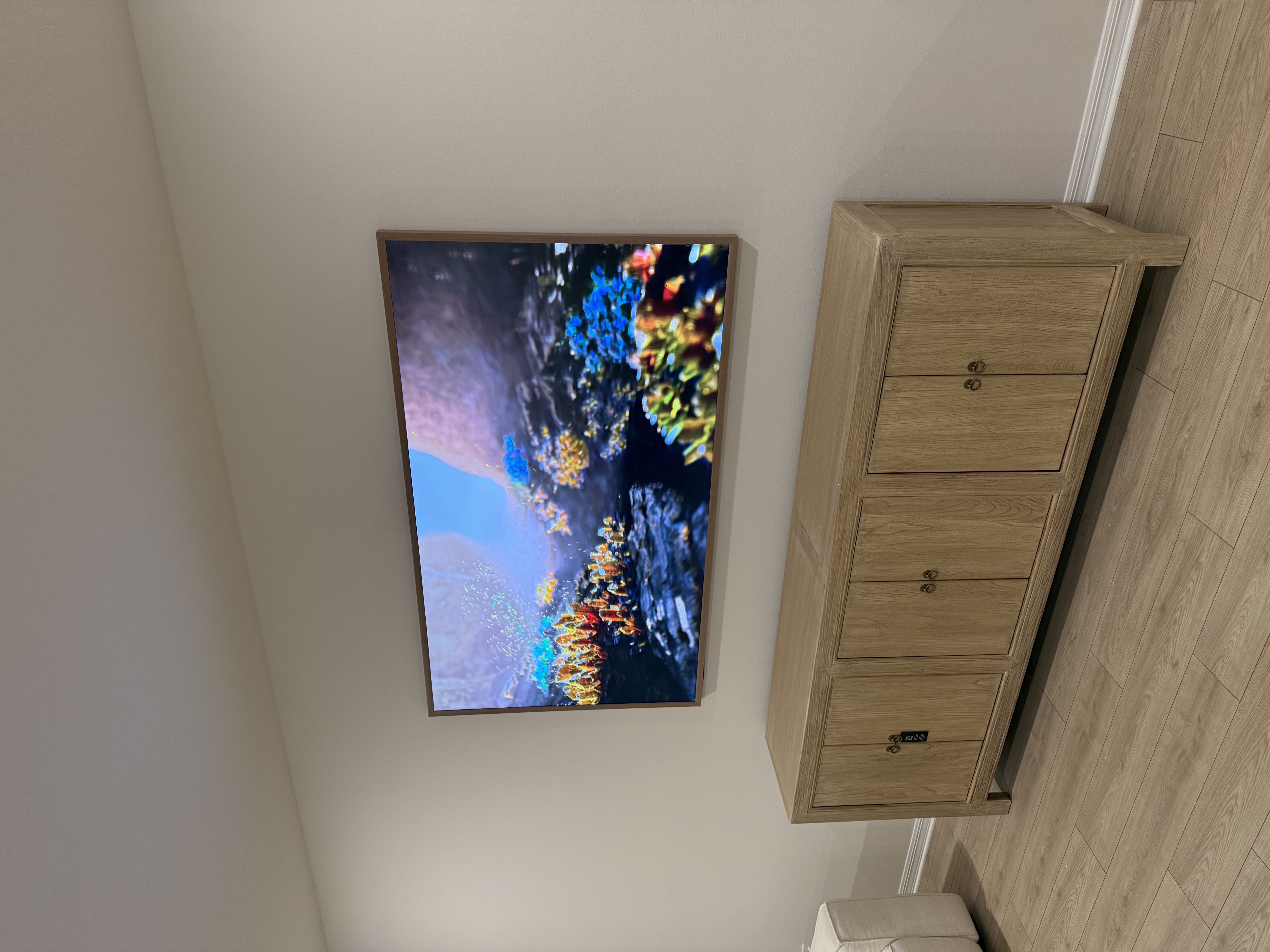 TV mounting service in Bradenton, Florida featuring a Samsung Frame TV mounted flush against the wall displaying art