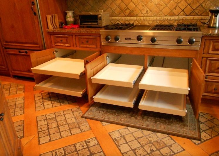 Custom roll-out shelving fit to an existing cabinet, by Myk's Woodworking