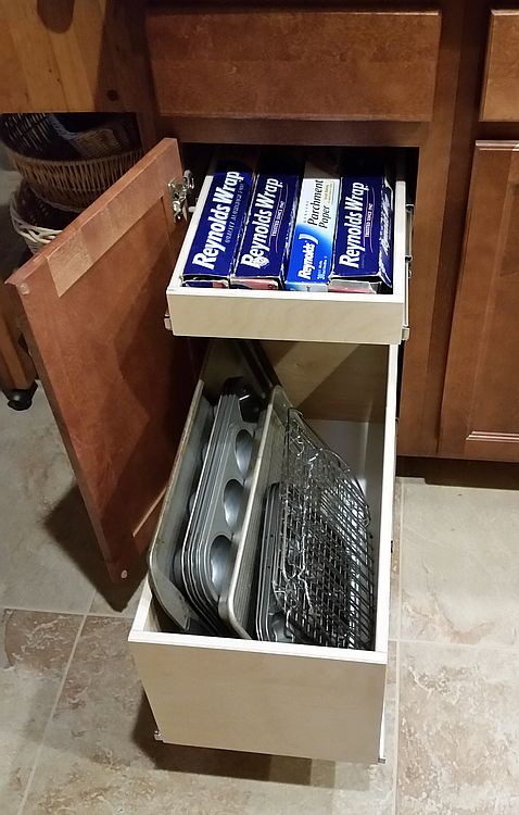 Roll-out shelving inside a base cabinet on full-extension slides, by Myk's Woodworking