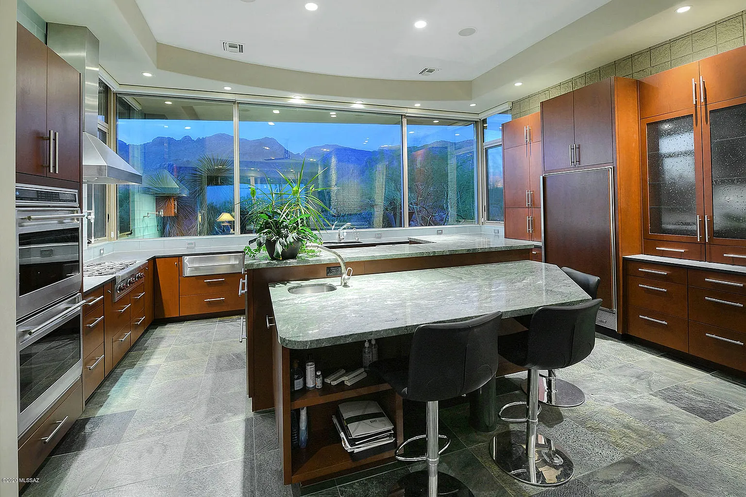 Contemporary cherry kitchen with waterfall island built by Myk's Woodworking in Pima Canyon, Tucson