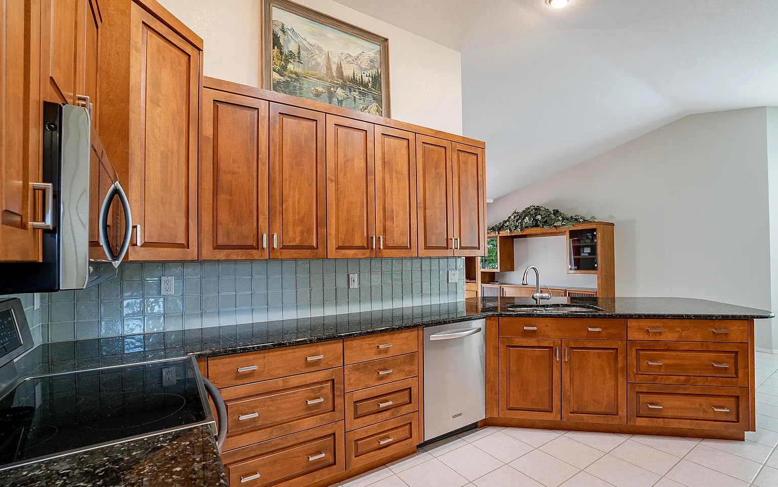 Warm wood raised-panel cabinets wide view, SaddleBrooke by Myk's Woodworking