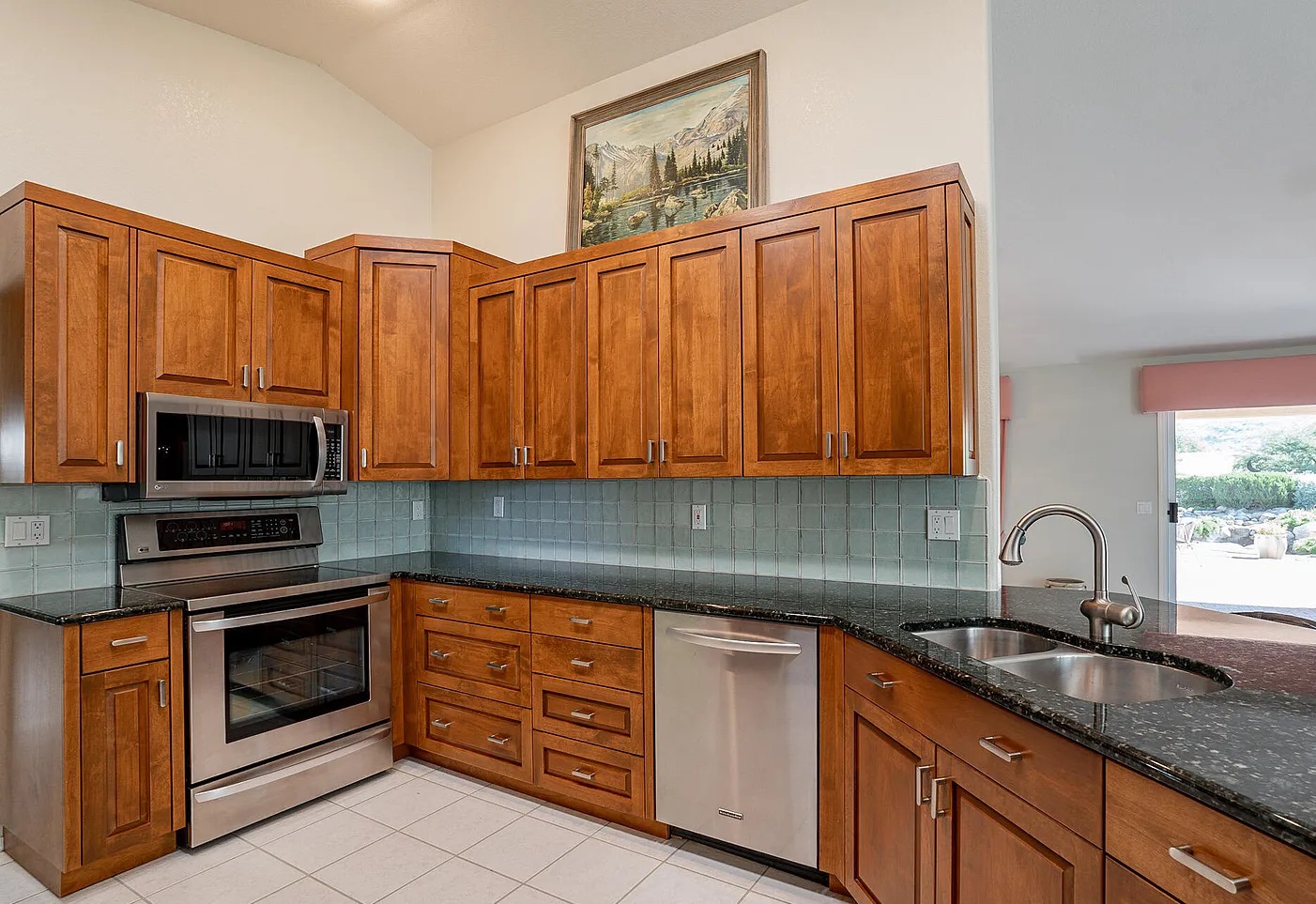 Raised-panel kitchen island and cabinetry, SaddleBrooke by Myk's Woodworking