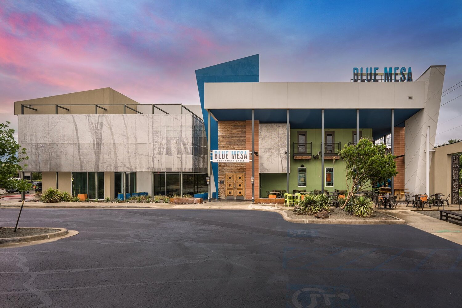 The 5th & Carroll Event Center building, above Blue Mesa, at dusk — the Fort Worth reception venue