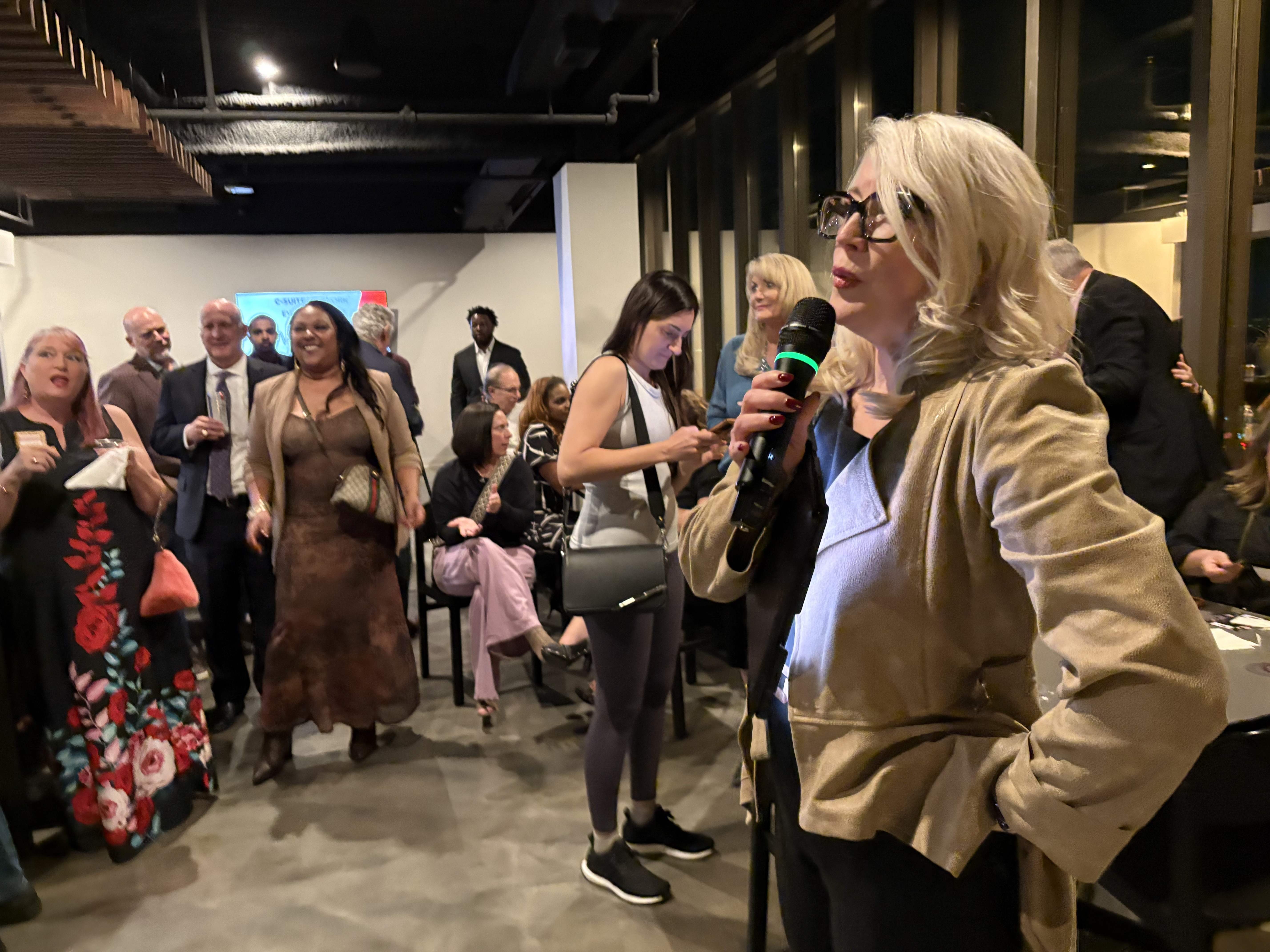 Hero Club members connecting at an evening reception