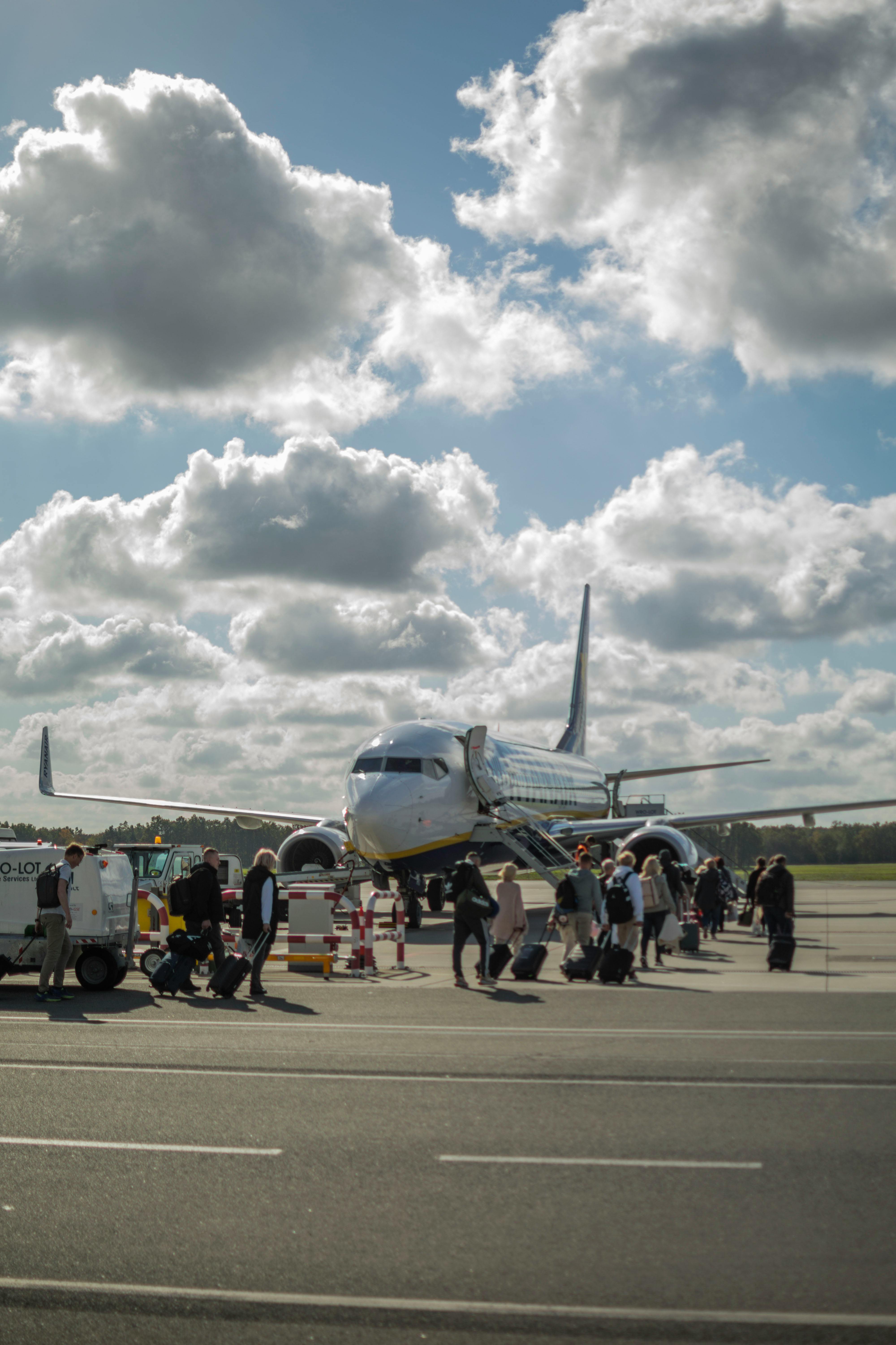 Holiday makers queueing to get on the plane