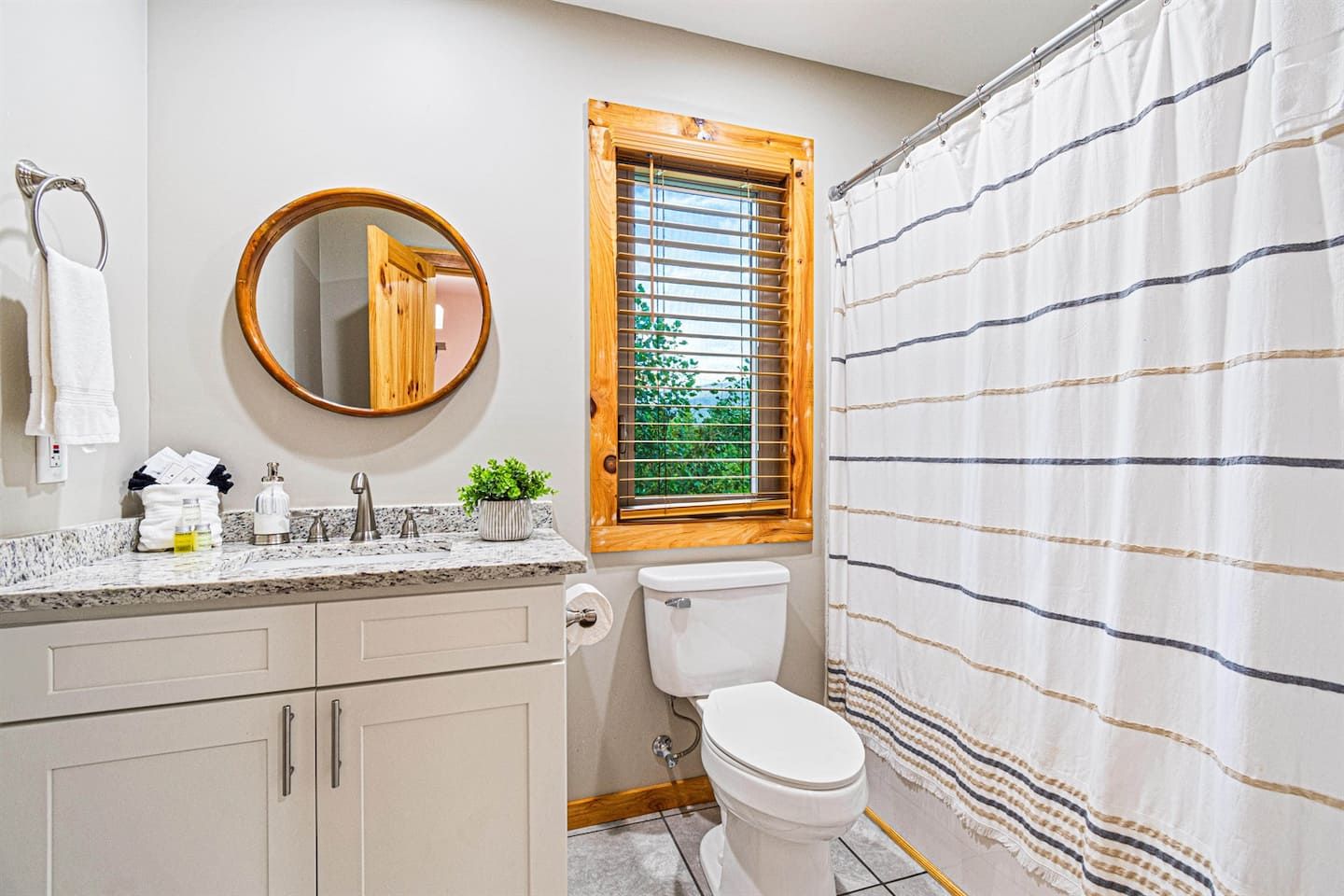 The queen bedroom is enhanced by a convenient ensuite bathroom, ensuring privacy and ease just steps away from your tranquil sleeping quarters. This feature adds a touch of luxury and function, making your stay even more relaxing and convenient.