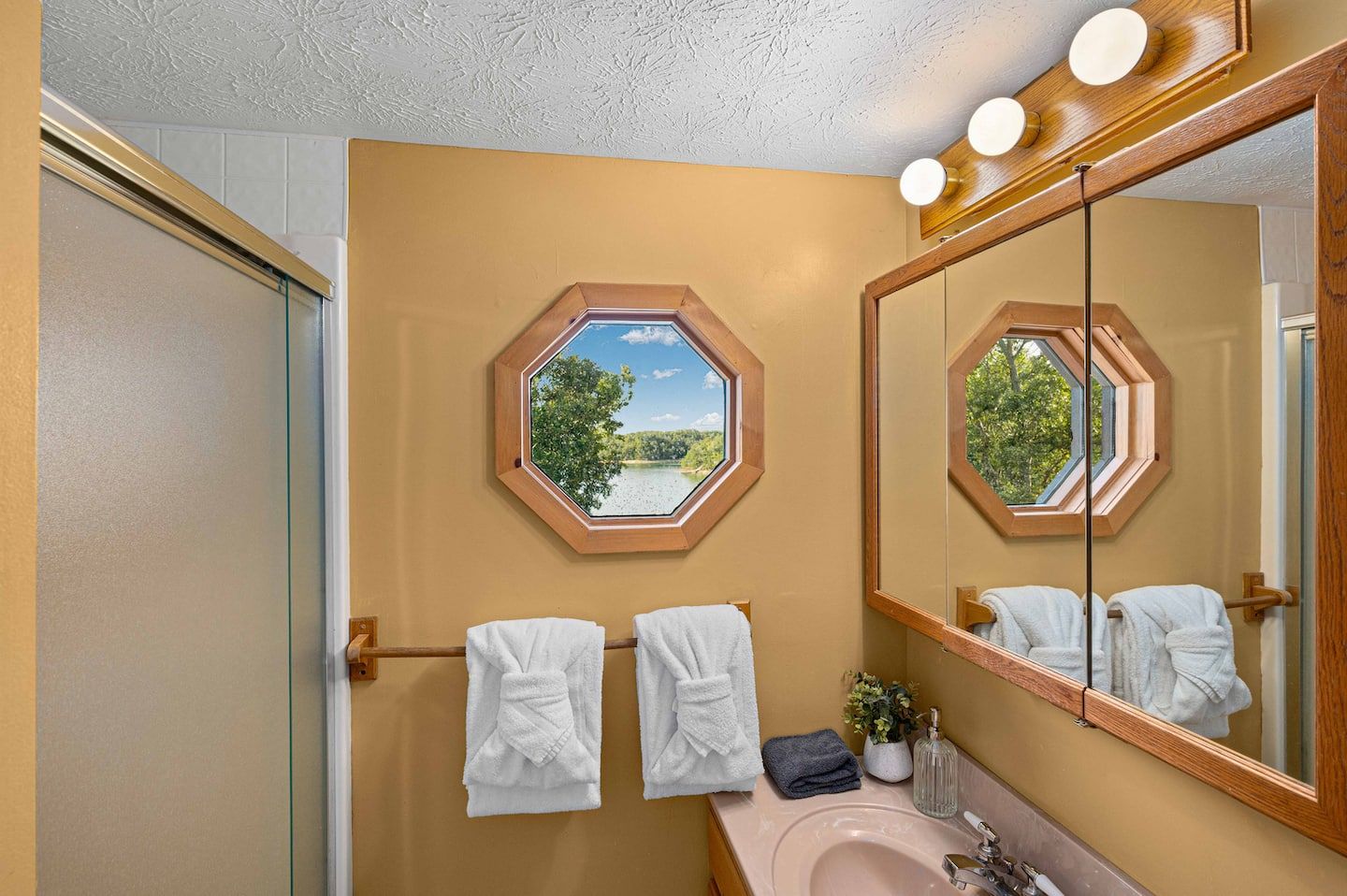 The upstairs full bathroom, serving both the loft and the upstairs king bedroom.