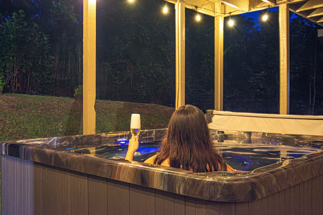 The hot tub under the porch at night