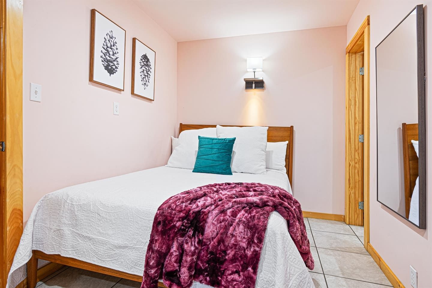 Step into the stylish comfort of our downstairs queen bedroom, which exudes a boutique feel. With an ensuite bathroom, this chic retreat offers peaceful sleep and mountain views, setting the tone for a tranquil and elegant start to your day.