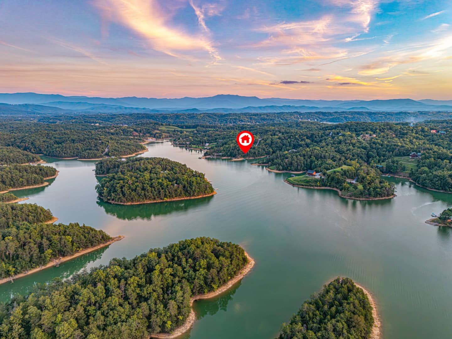Douglas Lake and Kajun Kove from above. Islands, coves, and the Great Smoky Mountains in the distance.