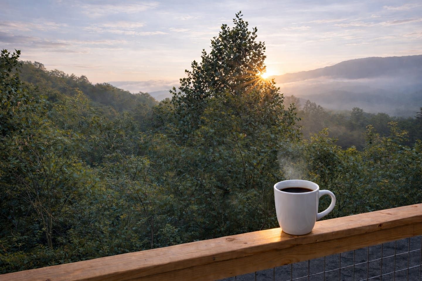 Morning coffee with a front-row seat to the Smokies—soft sunrise light, layered mountain views, and total peace right from your back deck.