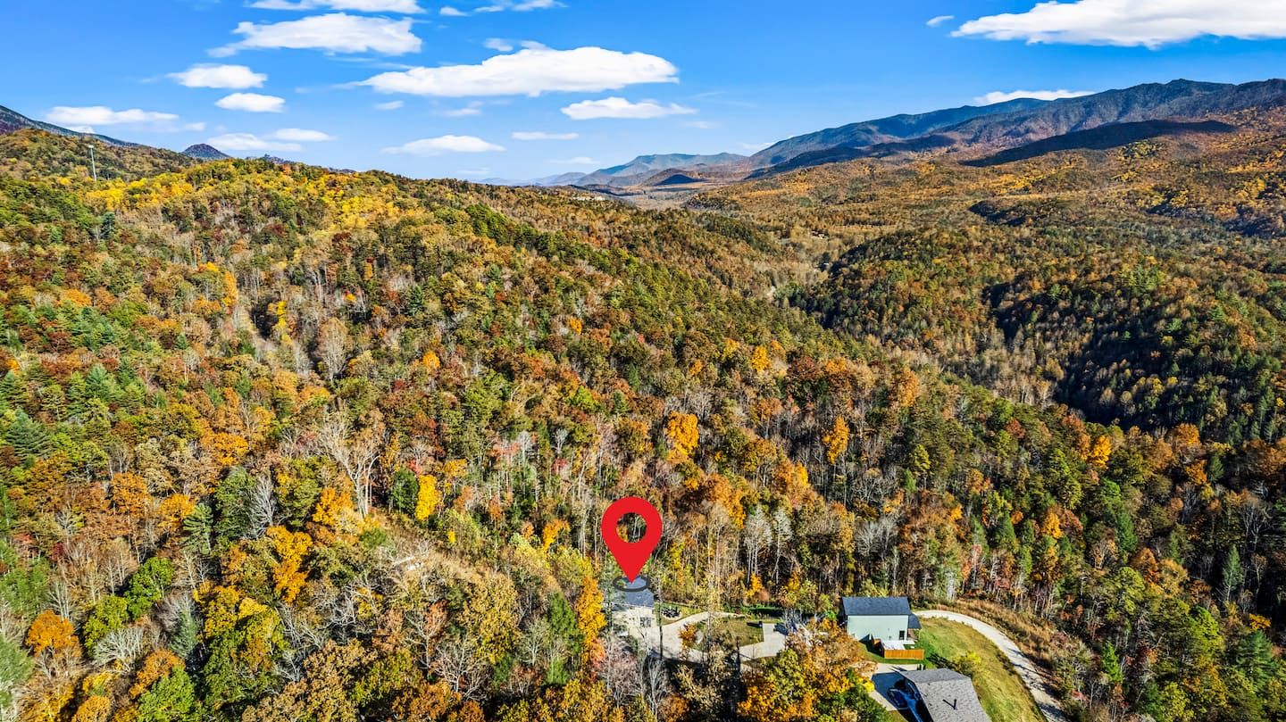 Perched atop a private mountain road in Pittman Center, Birdsong Ridge sits in the heart of the Smoky Mountains — surrounded by thousands of acres of national forest, with unobstructed views in every direction.